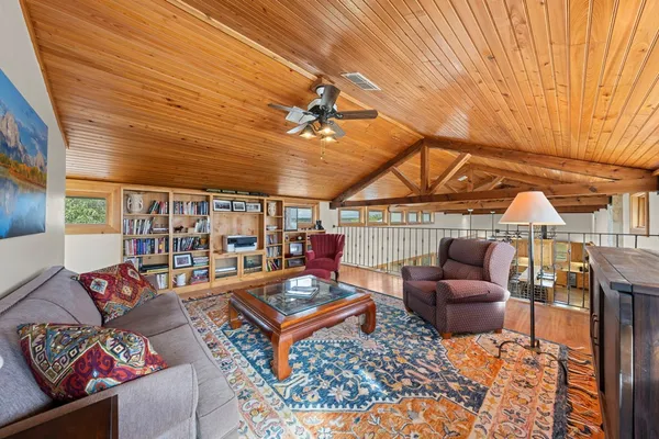 a dinning area with furniture and chandelier