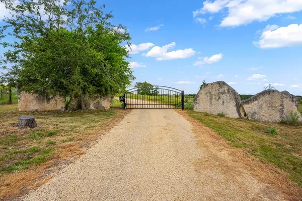 a view of a two chairs in a park