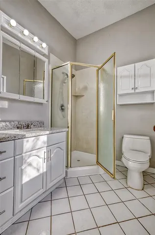 a view of backyard with wooden fence