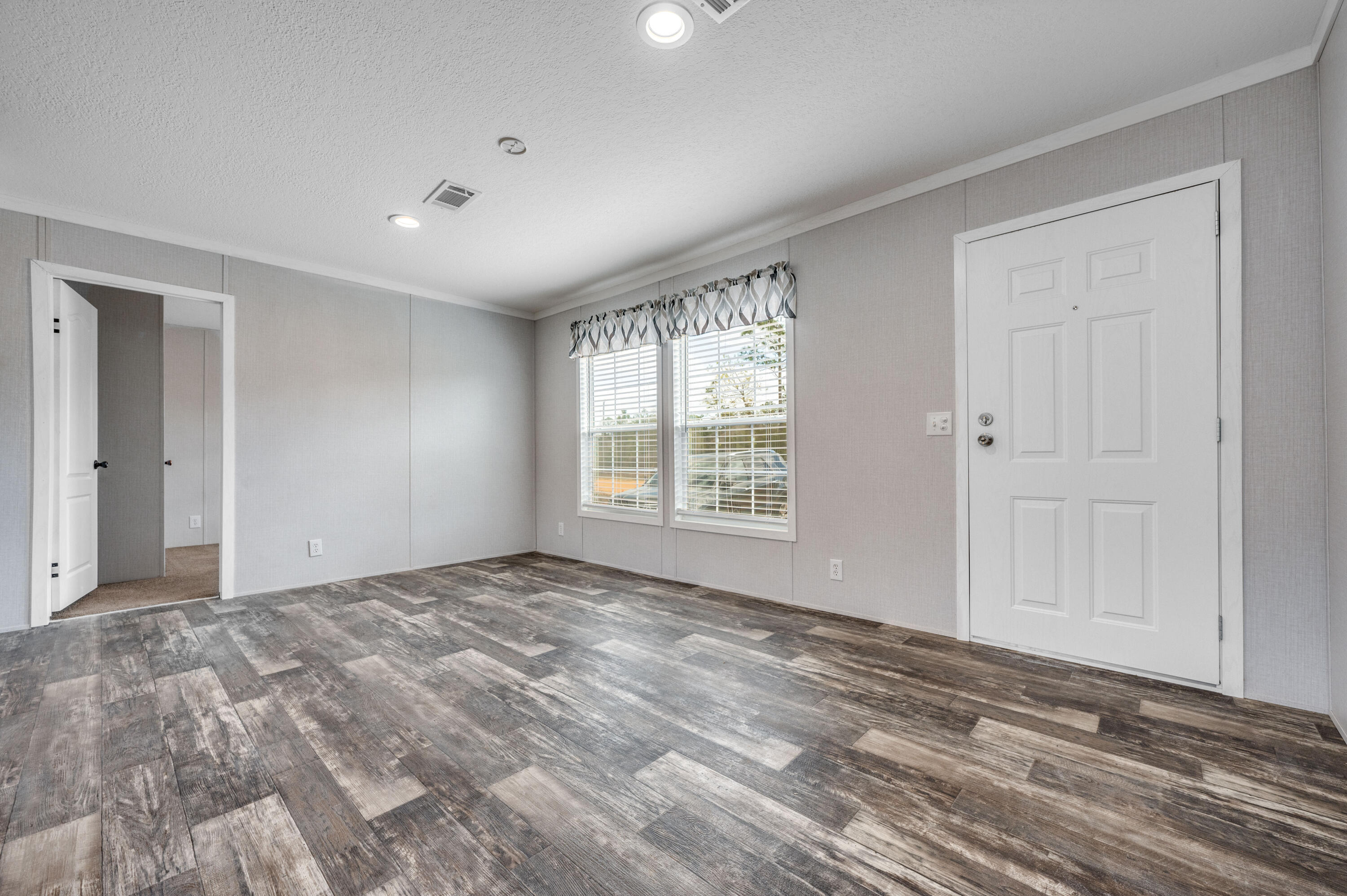 4679 Dove Way Crestview, FL 32539 - Photo 12 of 41 a view of room with window and hardwood floor
