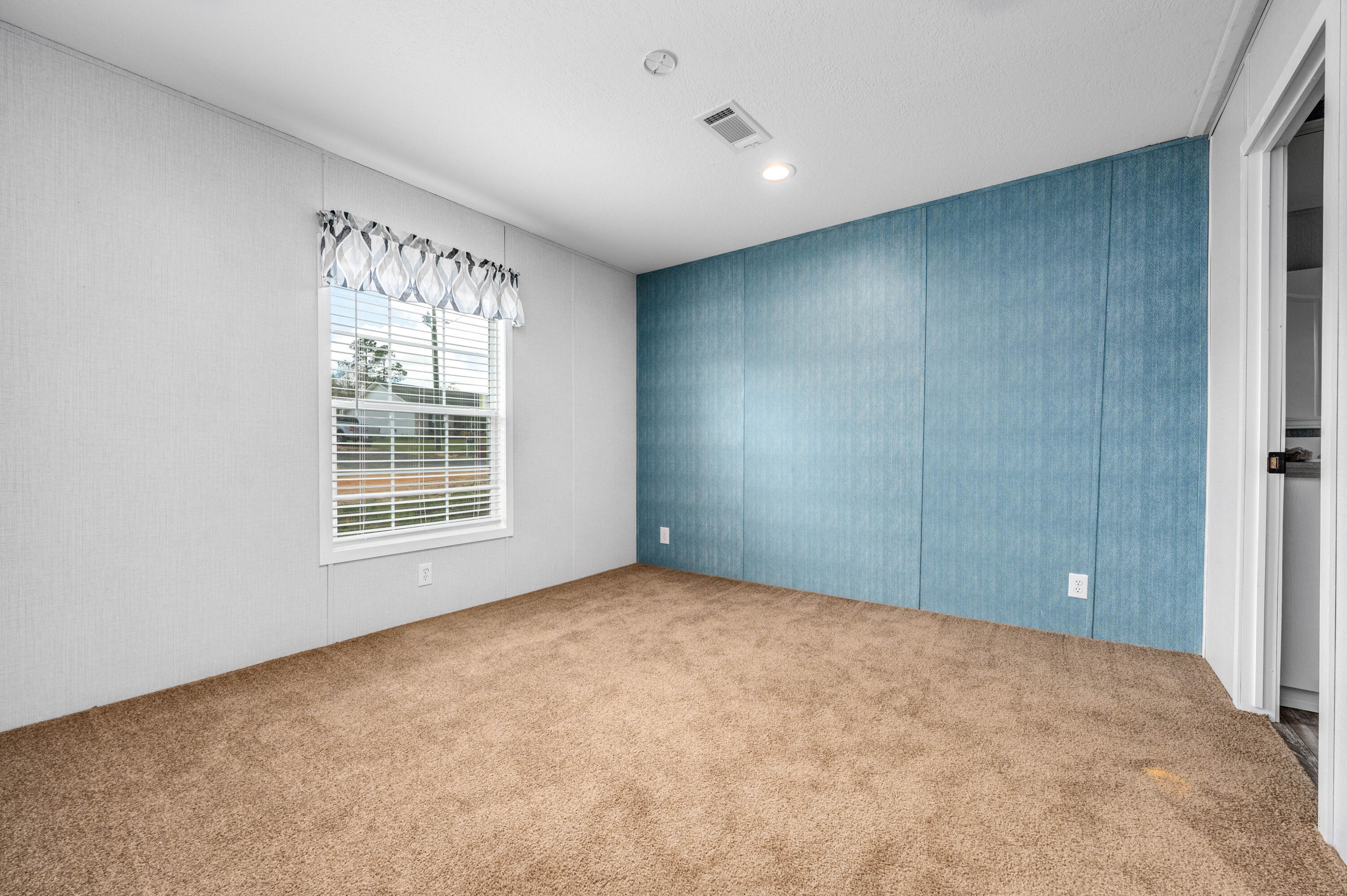 4679 Dove Way Crestview, FL 32539 - Photo 22 of 41 an empty room with windows and closet