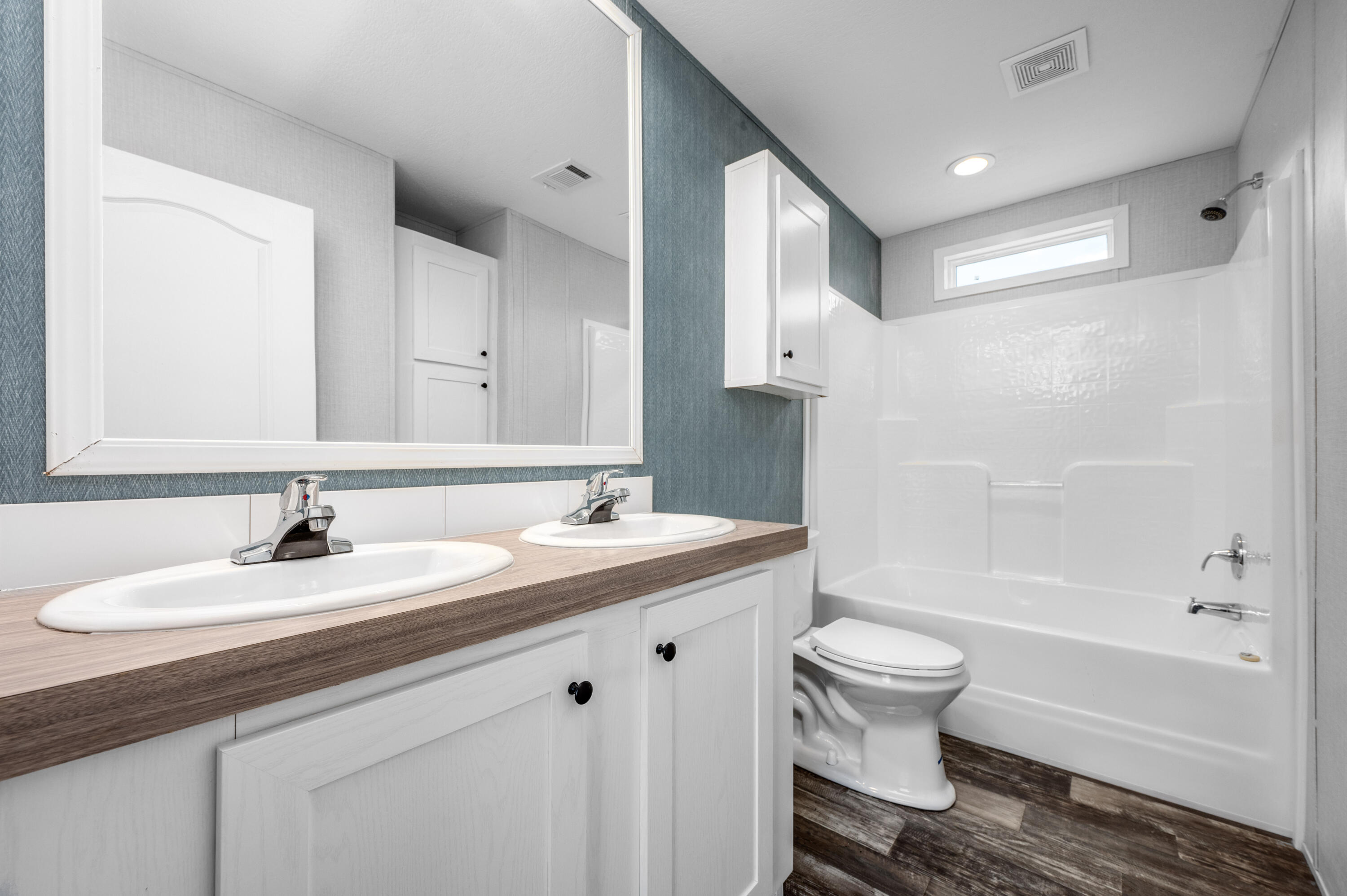 4679 Dove Way Crestview, FL 32539 - Photo 25 of 41 a bathroom with a granite countertop sink toilet and shower