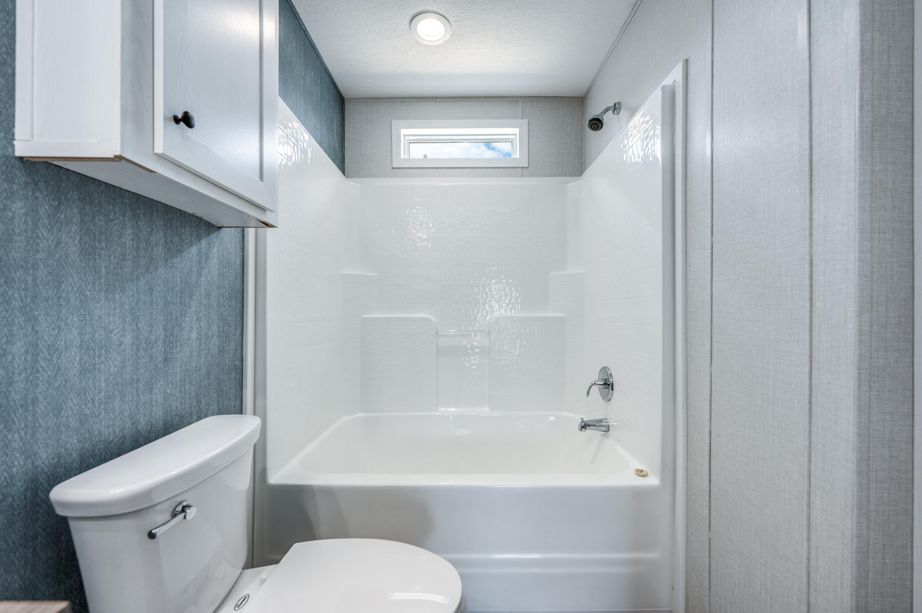 4679 Dove Way Crestview, FL 32539 - Photo 26 of 41 a bathroom with a toilet and a bathtub