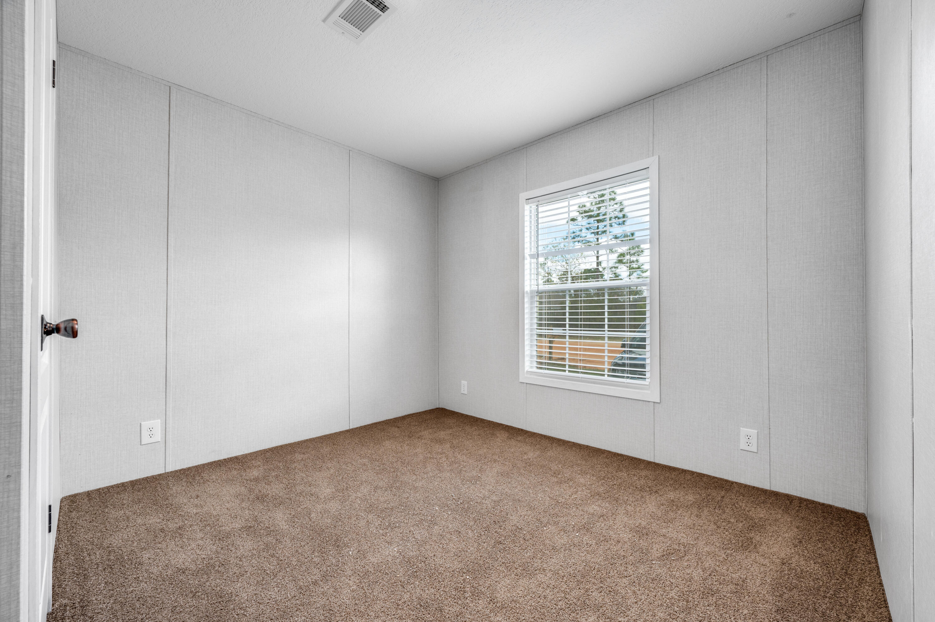 4679 Dove Way Crestview, FL 32539 - Photo 29 of 41 a view of an empty room with a window