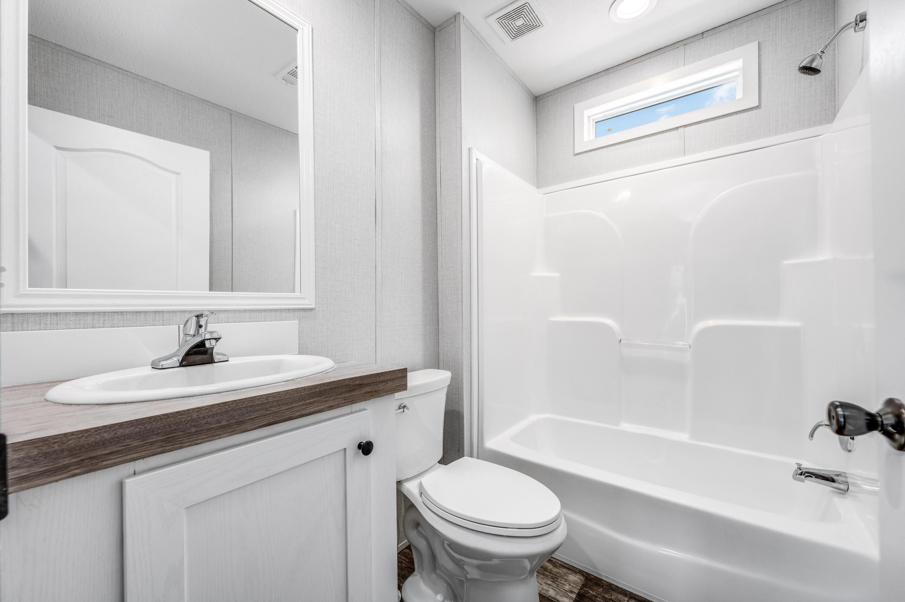 4679 Dove Way Crestview, FL 32539 - Photo 32 of 41 a bathroom with a sink a toilet and a bathtub