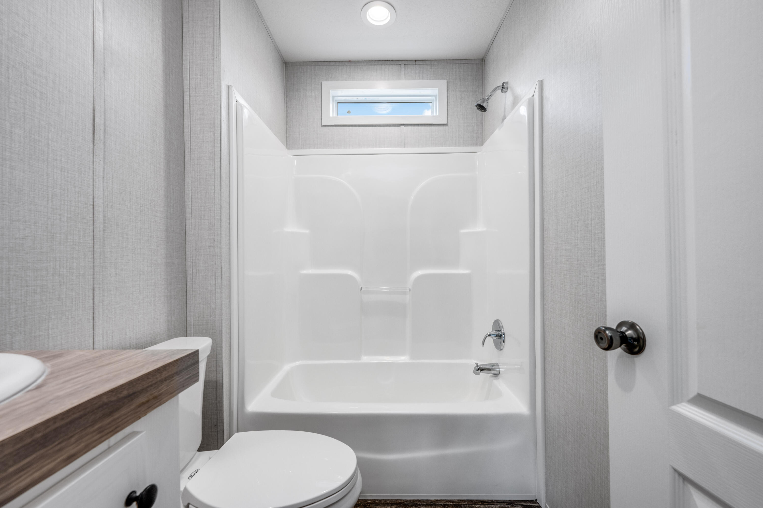 4679 Dove Way Crestview, FL 32539 - Photo 34 of 41 a bathroom with a toilet and a bathtub