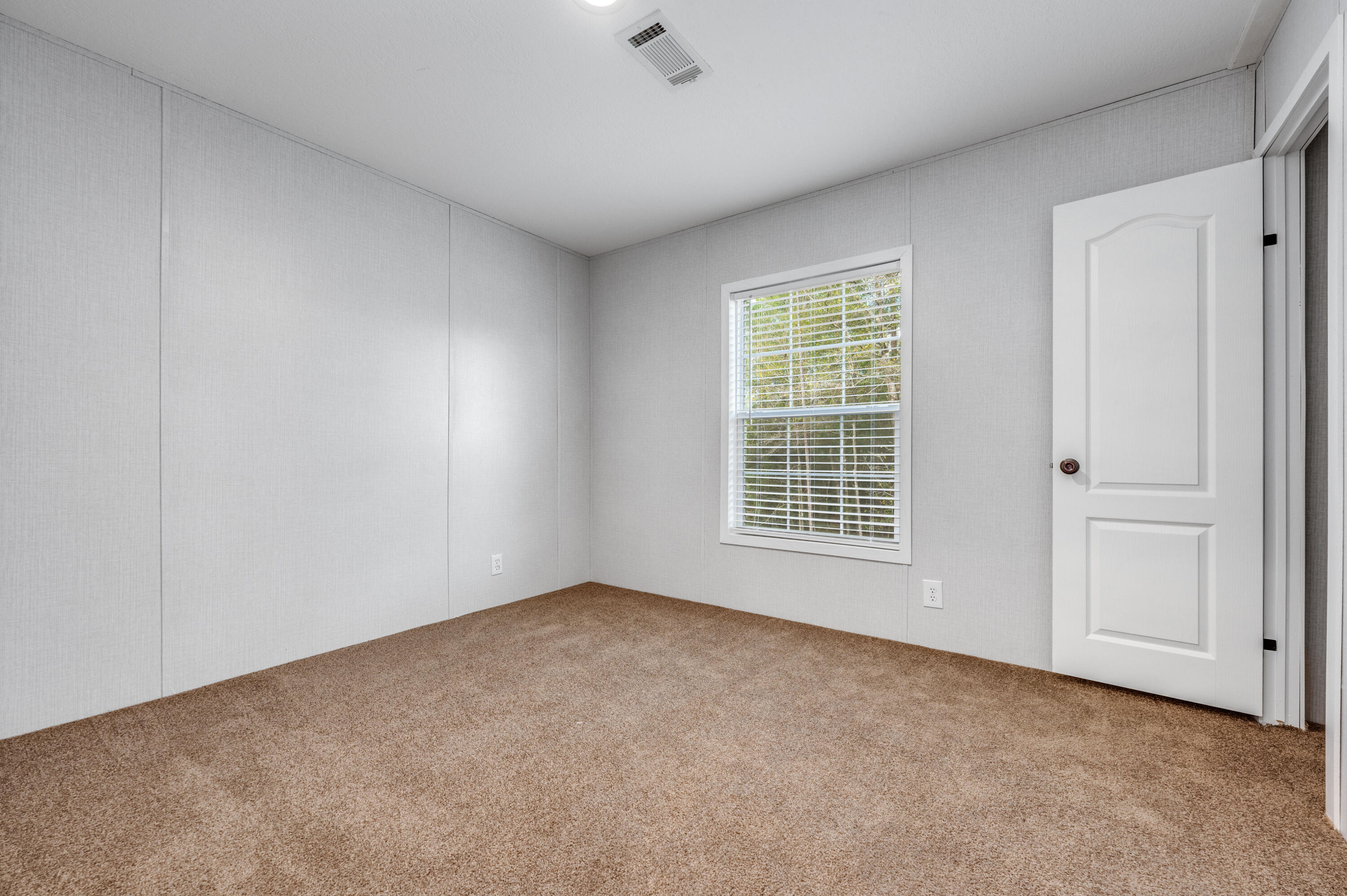 4679 Dove Way Crestview, FL 32539 - Photo 35 of 41 a view of an empty room with a window