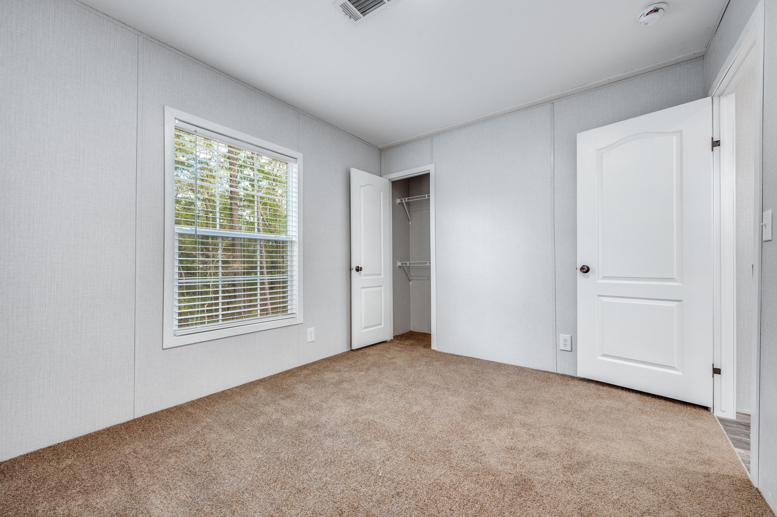 4679 Dove Way Crestview, FL 32539 - Photo 36 of 41 a view of an empty room with a window