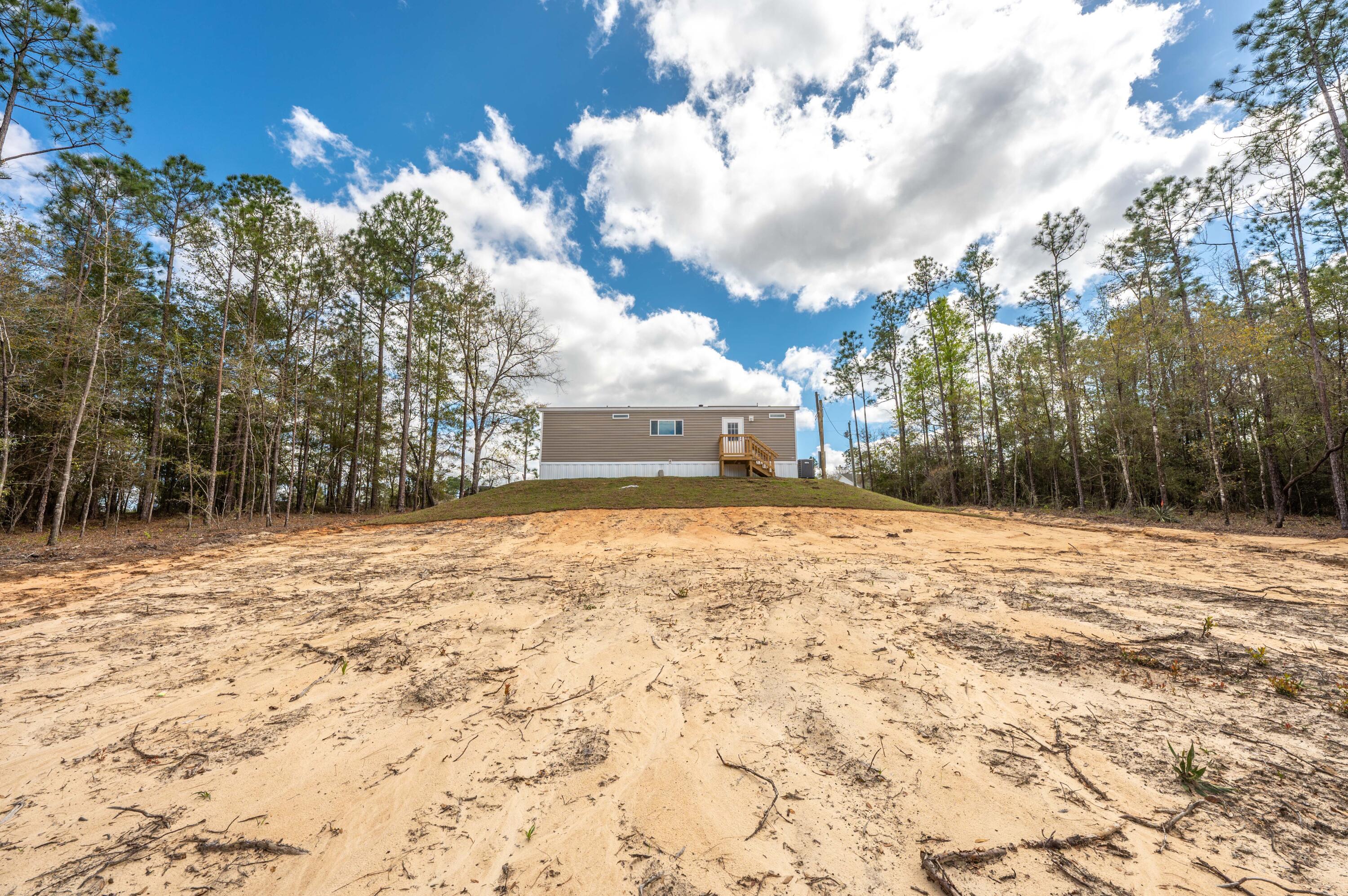 4679 Dove Way Crestview, FL 32539 - Photo 39 of 41 a view of a yard with a house