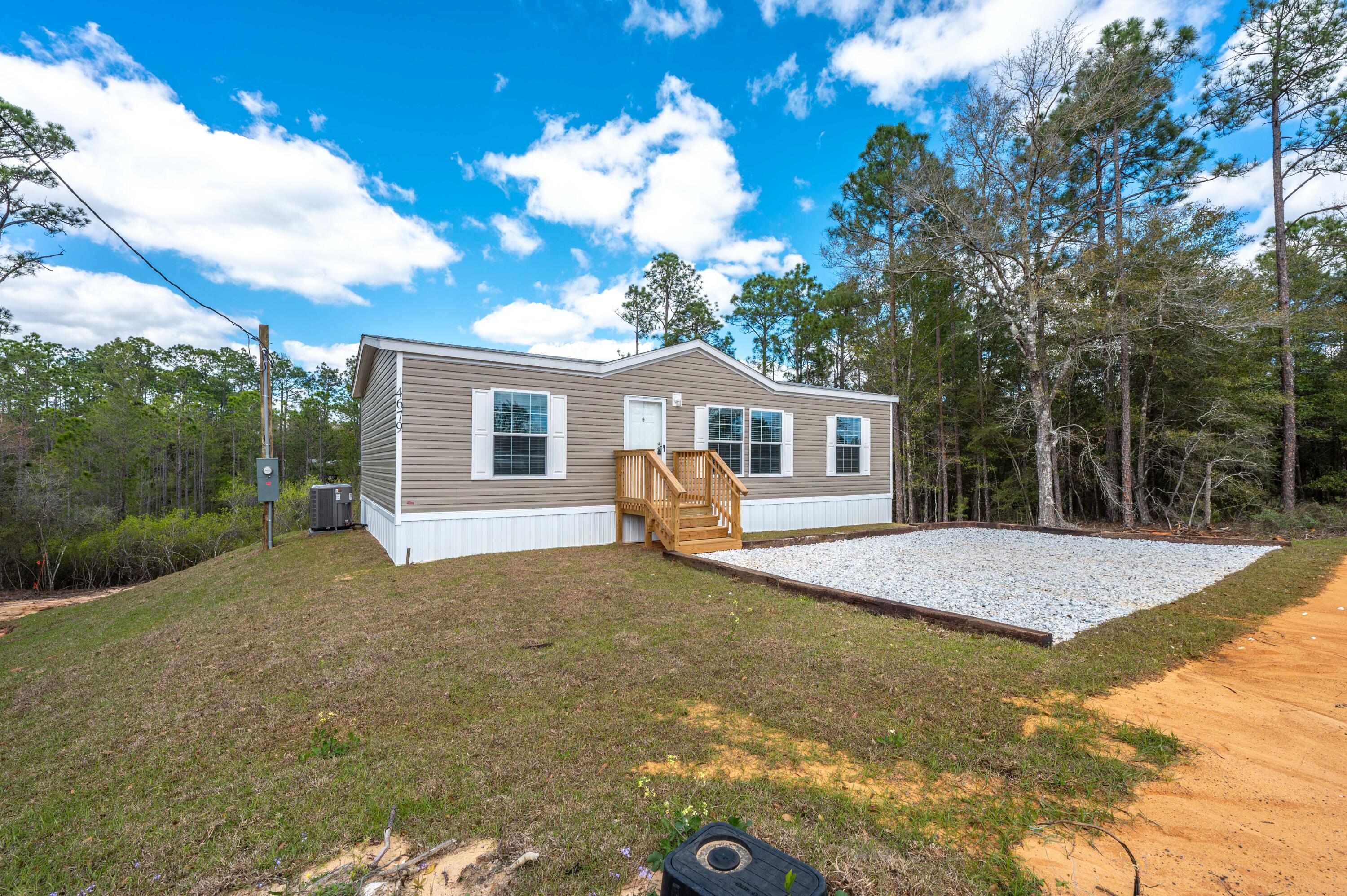 4679 Dove Way Crestview, FL 32539 - Photo 4 of 41 a house view with a backyard space