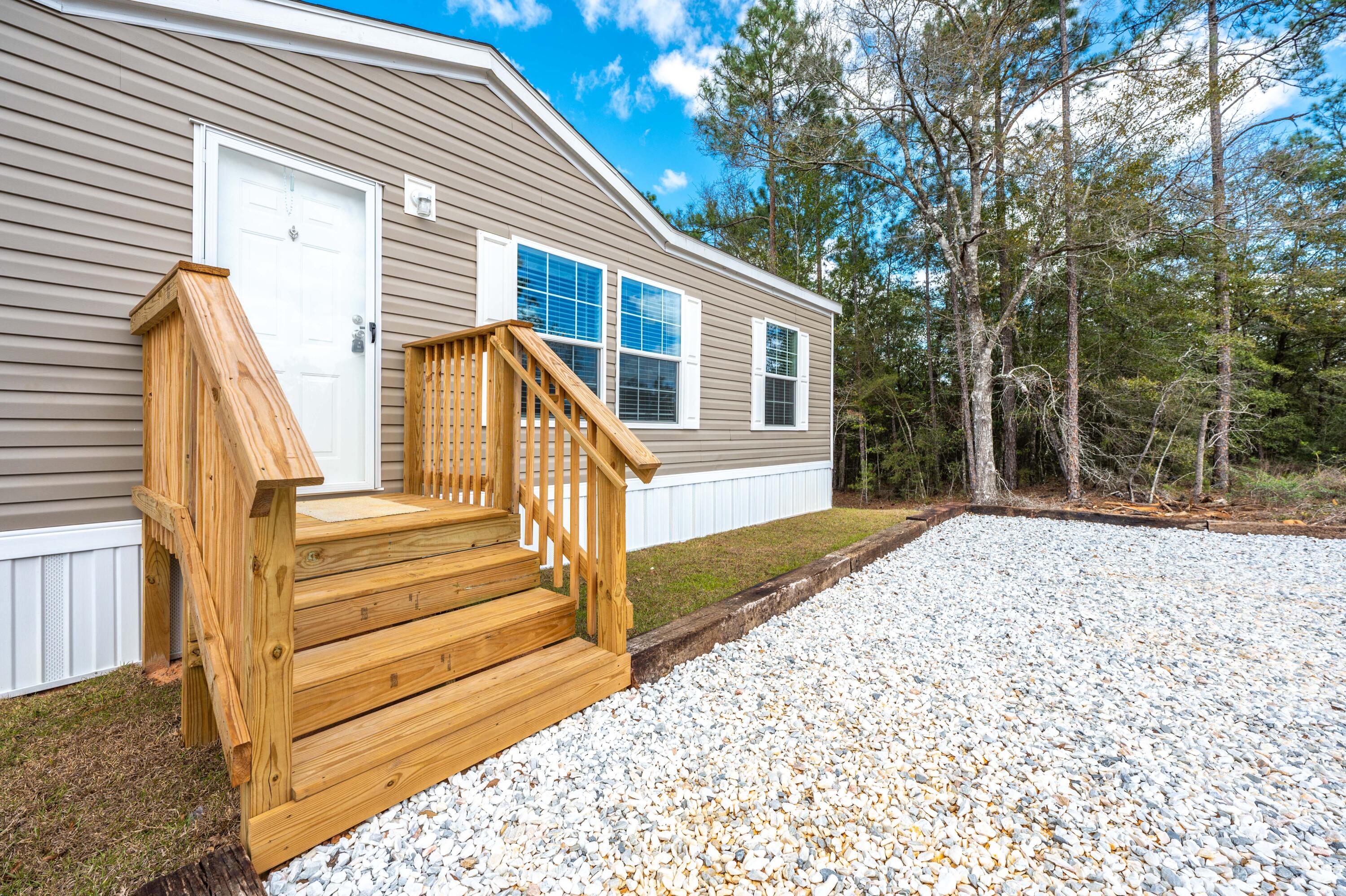 4679 Dove Way Crestview, FL 32539 - Photo 5 of 41 a view of a house with a yard