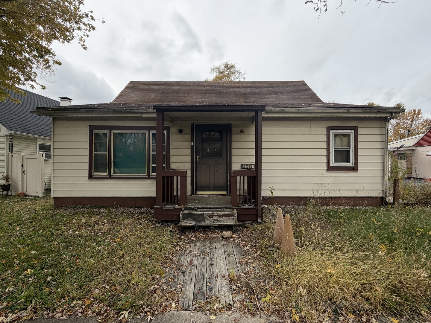 a front view of a house with a garden
