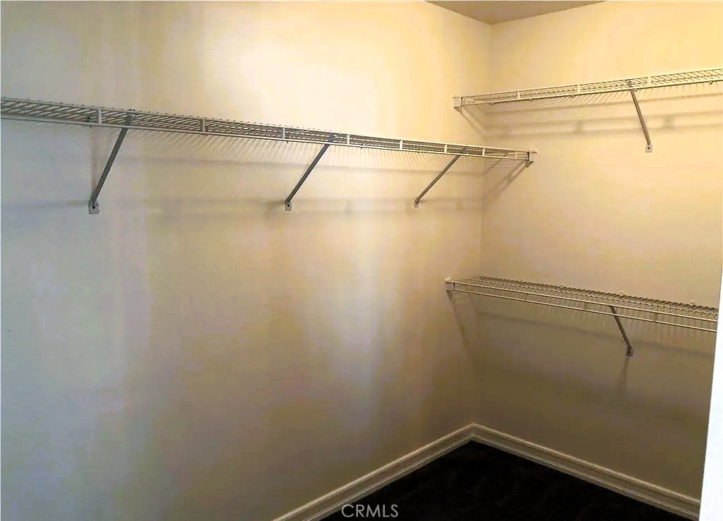 643 Dunkirk Drive Oxnard, CA 93035 - Photo 12 of 18 a view of a room with racks on the wall