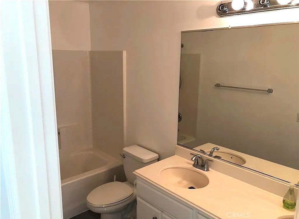 643 Dunkirk Drive Oxnard, CA 93035 - Photo 15 of 18 a bathroom with a sink toilet and shower