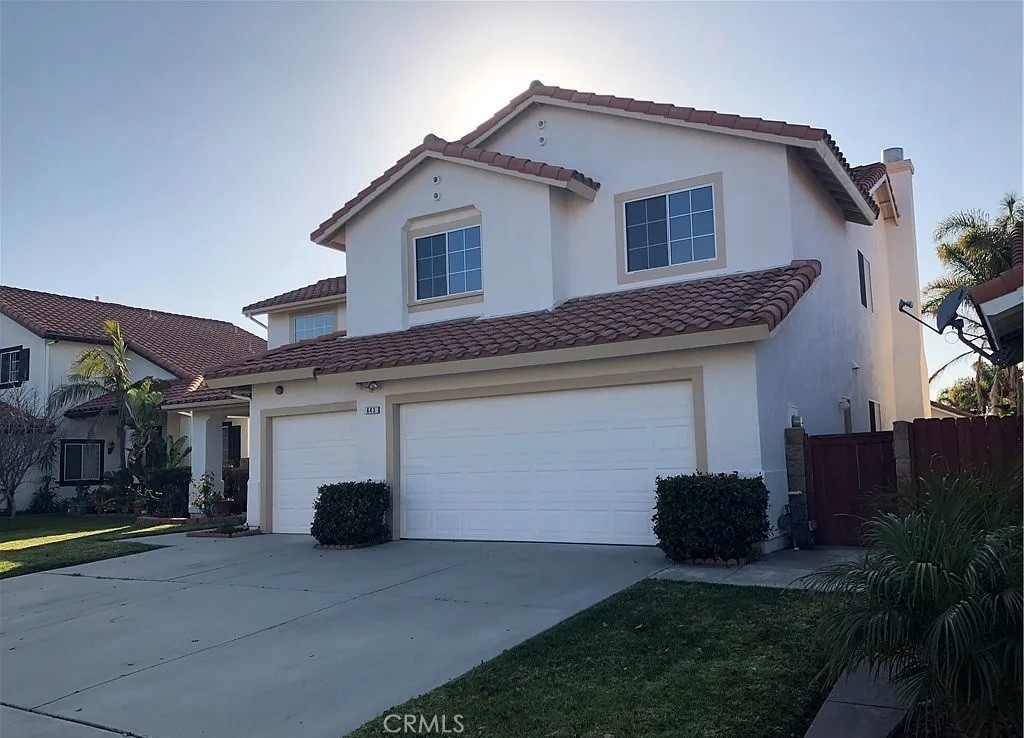 643 Dunkirk Drive Oxnard, CA 93035 - Photo 2 of 18 a front view of a house with a yard and garage