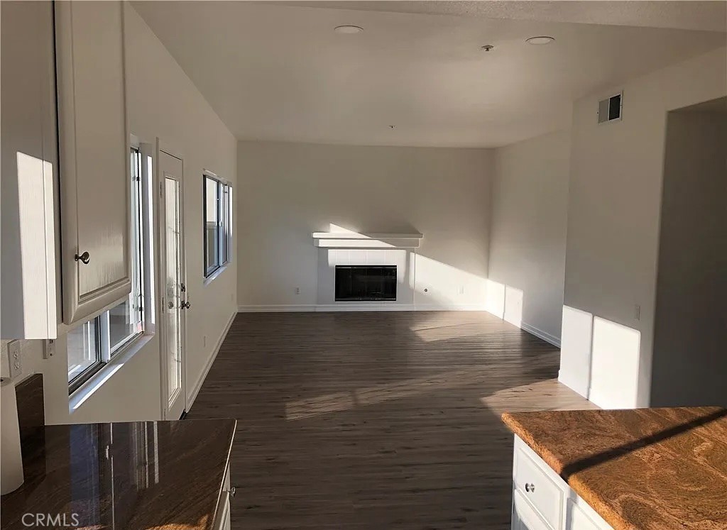 643 Dunkirk Drive Oxnard, CA 93035 - Photo 3 of 18 a kitchen with granite countertop a stove and a fireplace