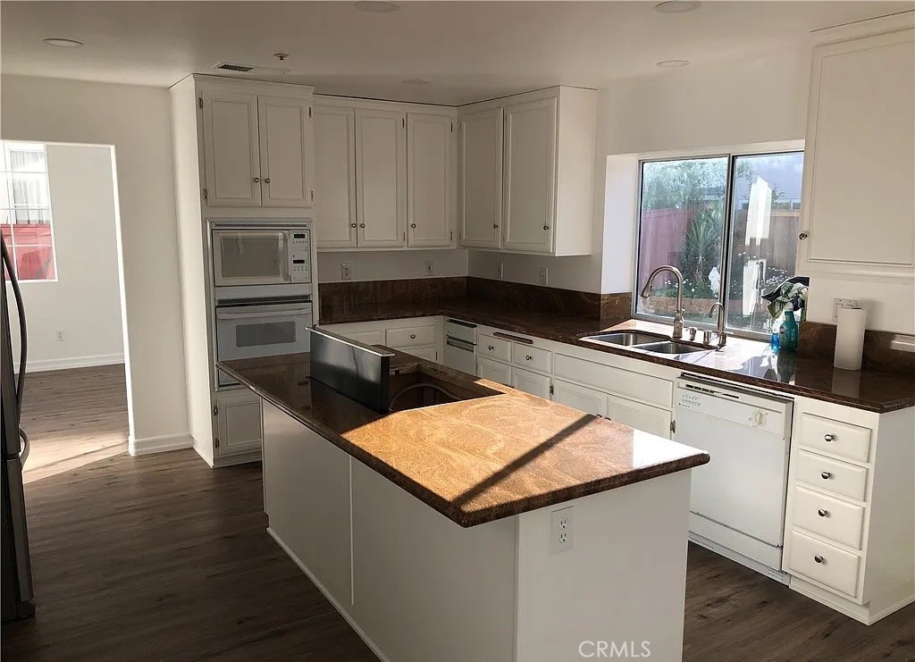 643 Dunkirk Drive Oxnard, CA 93035 - Photo 4 of 18 a kitchen with stainless steel appliances granite countertop a stove a sink and a refrigerator