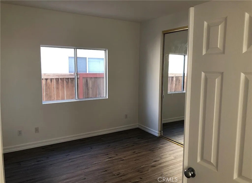 643 Dunkirk Drive Oxnard, CA 93035 - Photo 5 of 18 a view of an empty room with wooden floor and a window