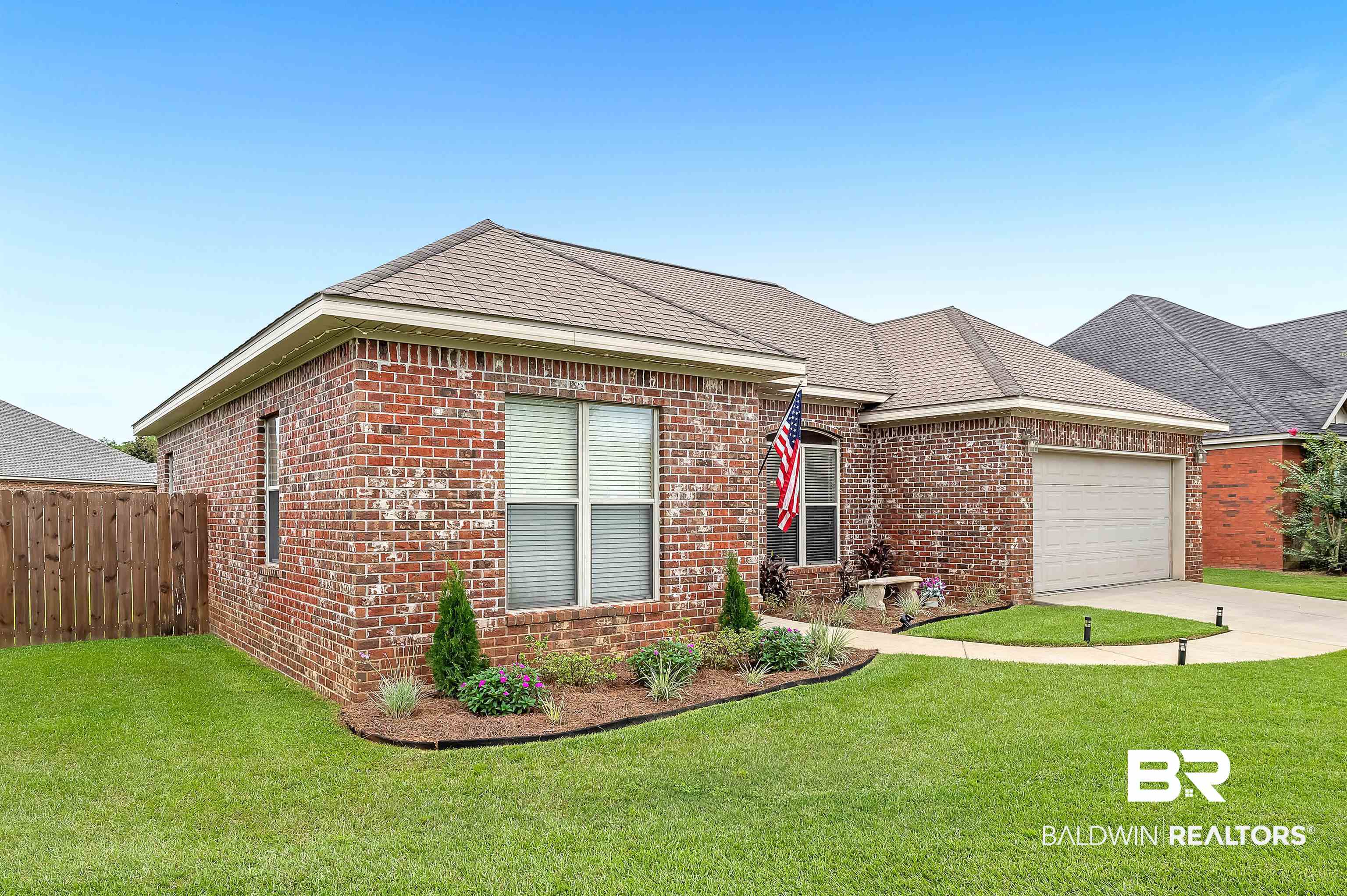9376 Sable Court Daphne, AL 36526 - Photo 4 of 46 View of front of property with a garage and a front lawn