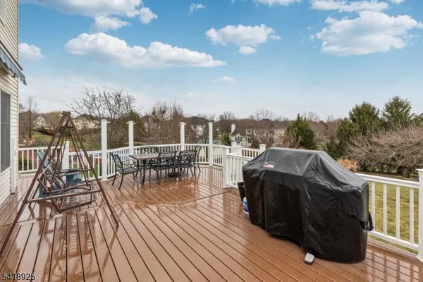 a view of a deck with furniture and wooden floor