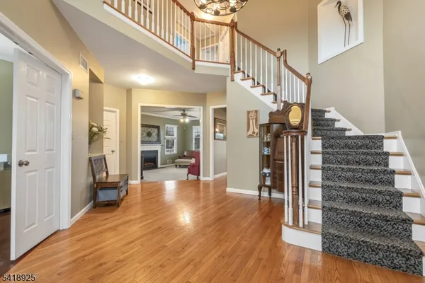 a view of an entryway with wooden floor and door