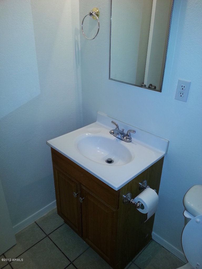 3043 West Bloomfield Road Phoenix, AZ 85029 - Photo 15 of 18 a bathroom with a sink toilet and mirror