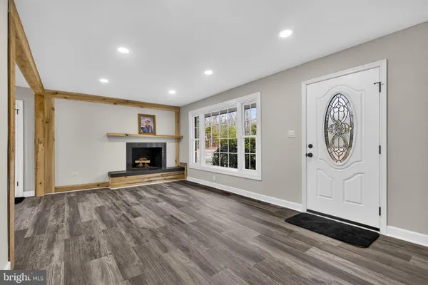 a kitchen with stainless steel appliances granite countertop a refrigerator stove and sink