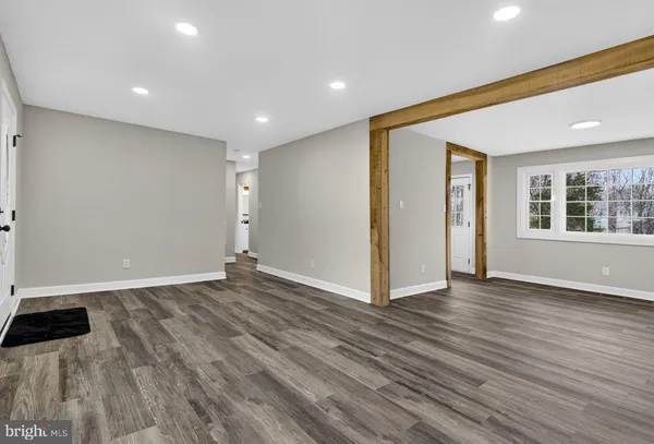 a bathroom with a sink a mirror and a shower
