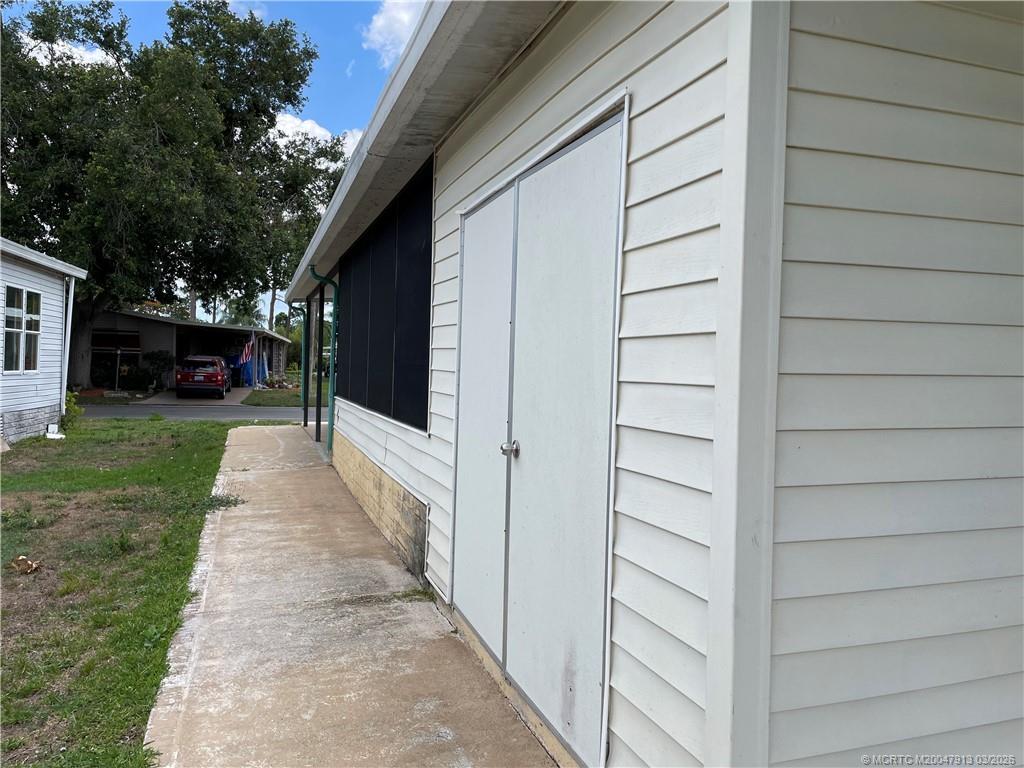 16398 Southwest Two Wood Way Indiantown, FL 34956 - Photo 22 of 24 a view of a back yard of the house