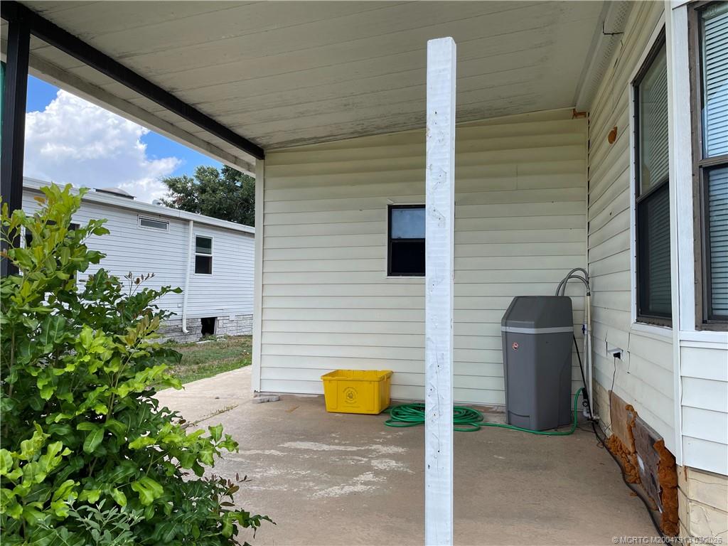 16398 Southwest Two Wood Way Indiantown, FL 34956 - Photo 23 of 24 a view of a porch with seating space
