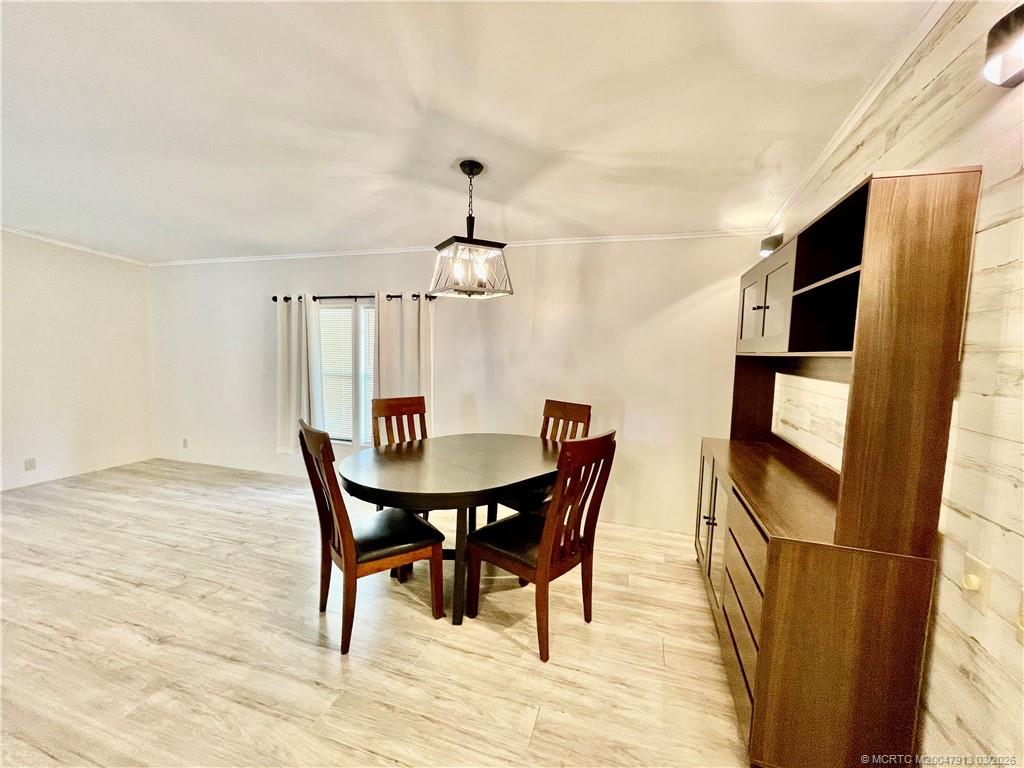 16398 Southwest Two Wood Way Indiantown, FL 34956 - Photo 10 of 24 a view of a dining room with furniture