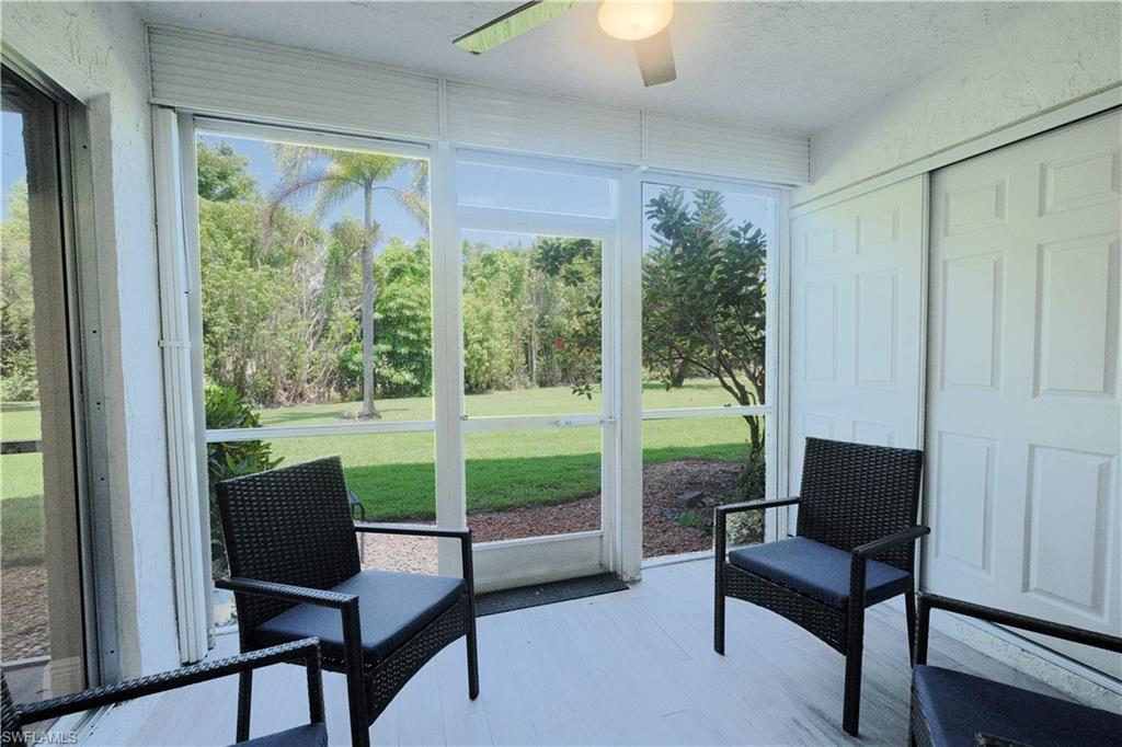 5499 Rattlesnake Hammock Road, Unit A105 Naples, FL 34113 - Photo 15 of 23 Sunroom / solarium with a healthy amount of sunlight and ceiling fan