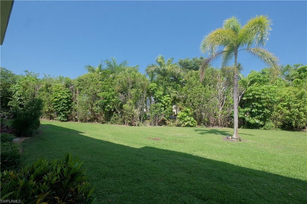 5499 Rattlesnake Hammock Road, Unit A105 Naples, FL 34113 - Photo 23 of 23 View of yard