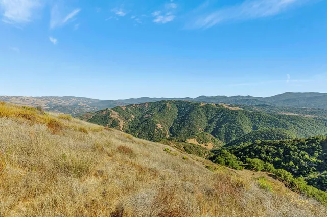 a view of a town with mountains in the background