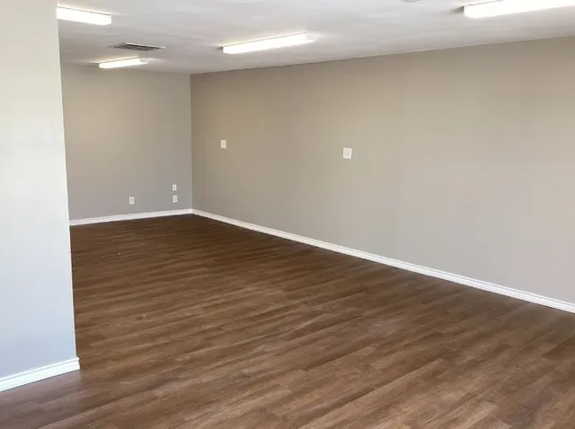 a white toilet sitting next to a sink