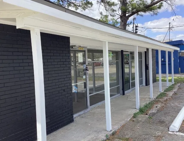 a house with trees in the background