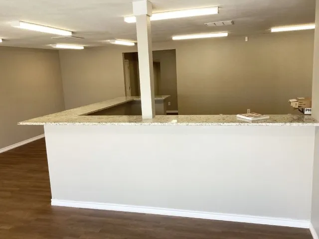 a view of kitchen with wooden floor