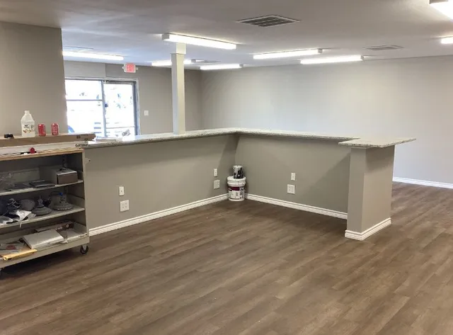 an empty room with wooden floor