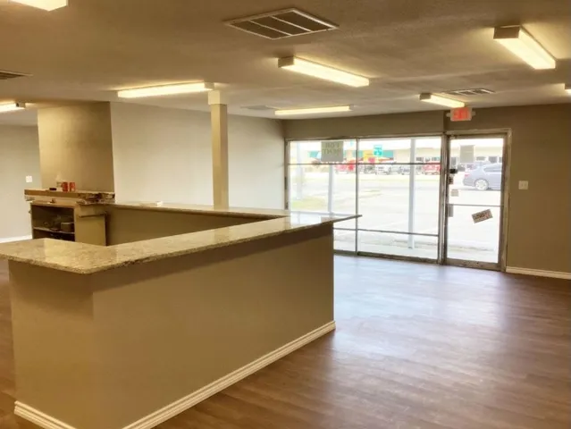 a view of a kitchen with a sink and a dishwasher