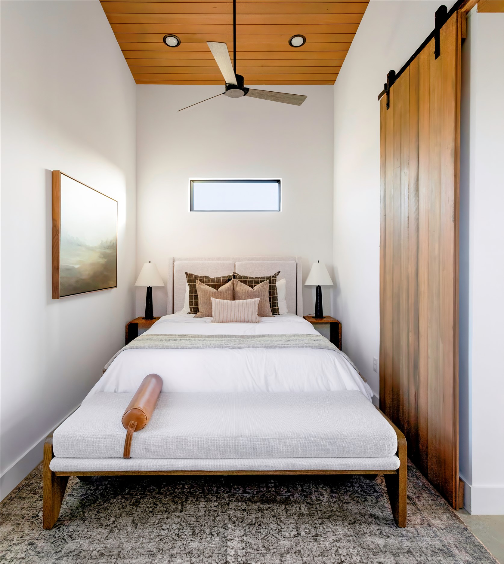 312 Hye Springs Road, Unit 106 Hye, TX 78635 - Photo 7 of 17 Cozy bedroom retreat with warm wood ceiling detail, designer finishes, and minimalist modern styling.