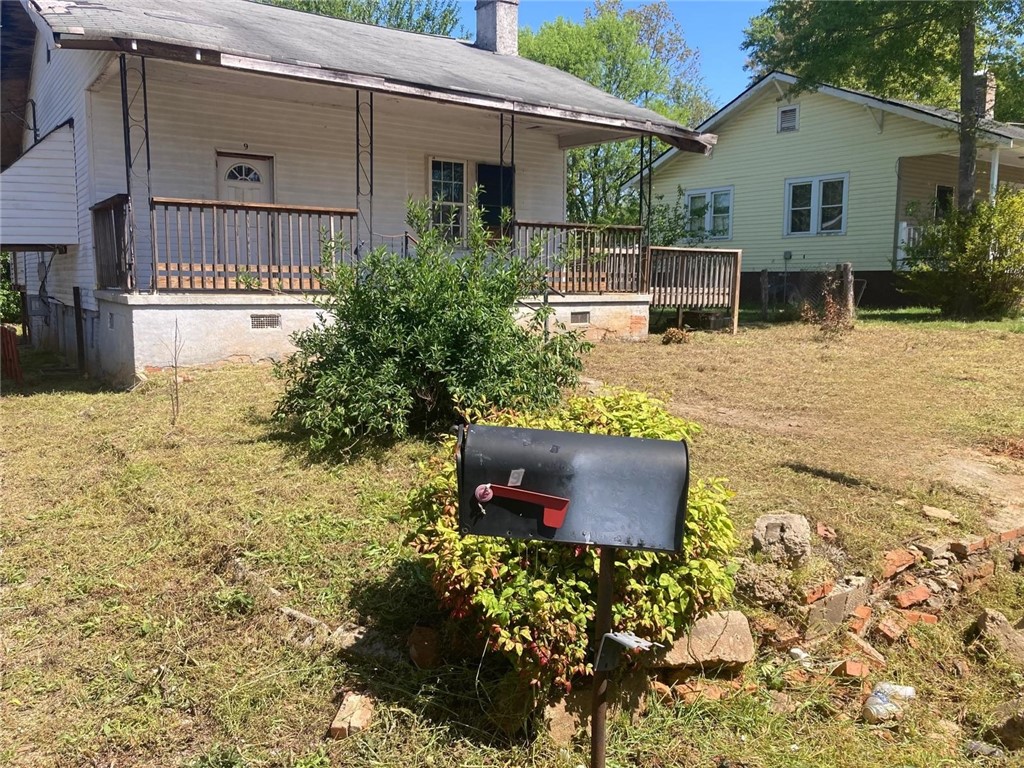 9 Humbert Street Seneca, SC 29678 - Photo 1 of 16 This charming home features a classic porch, inviting you to relax and enjoy the outdoor surroundings.