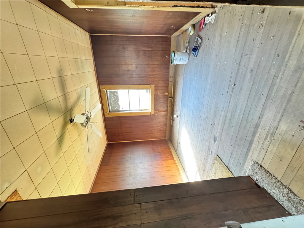 9 Humbert Street Seneca, SC 29678 - Photo 14 of 16 This interior offers classic wood flooring, rich paneled walls, and a convenient ceiling fan.