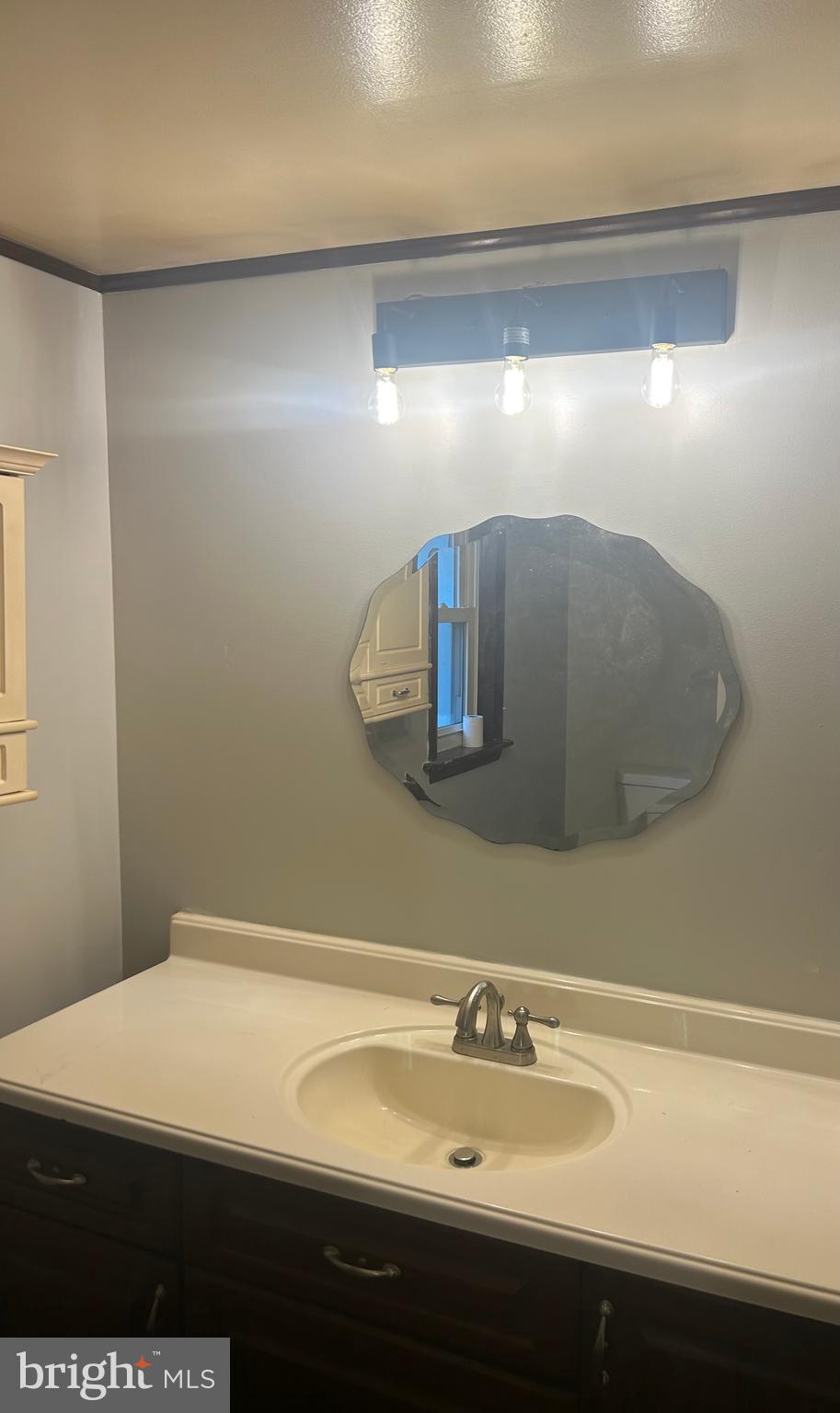 21626 New Freedom Road Freeland, MD 21053 - Photo 4 of 10 a bathroom with a sink and a mirror