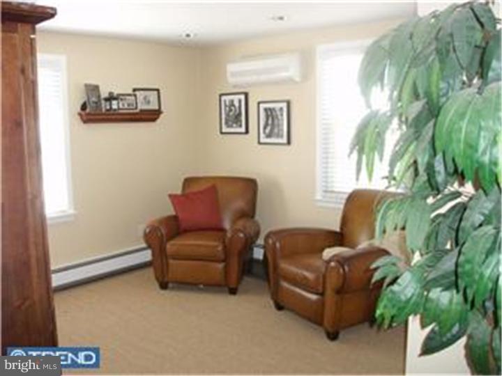 417 Suffolk Road Flourtown, PA 19031 - Photo 8 of 12 a living room with furniture and a potted plant