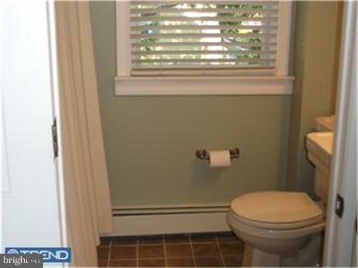 417 Suffolk Road Flourtown, PA 19031 - Photo 10 of 12 a bathroom with a toilet and a shower