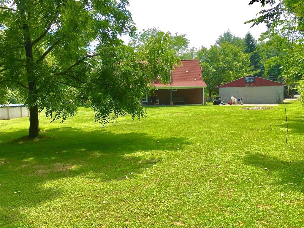 6149 Mifflin Road Pittsburgh, PA 15207 - Photo 22 of 25 BACK VIEW WITH SPACIOUS PORCH, POOL AND BASKETBALL COURT ON BACK OF GARAGE