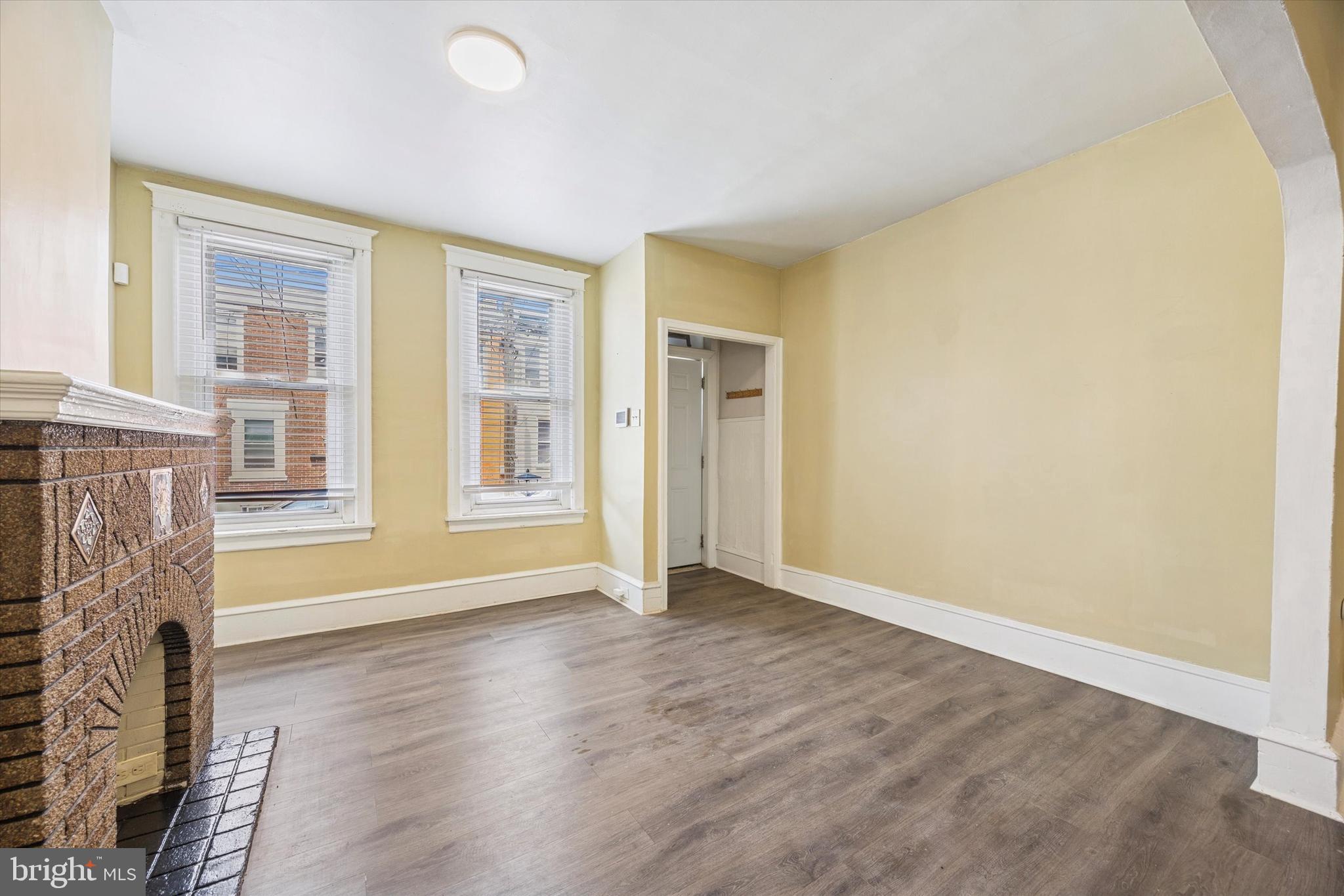 3053 Rorer Street Philadelphia, PA 19134 - Photo 6 of 15 a view of an empty room with wooden floor and a window