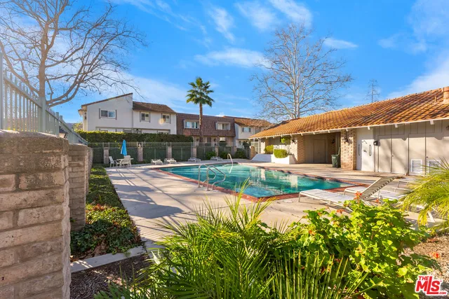 a view of a wrought iron fences in front of house