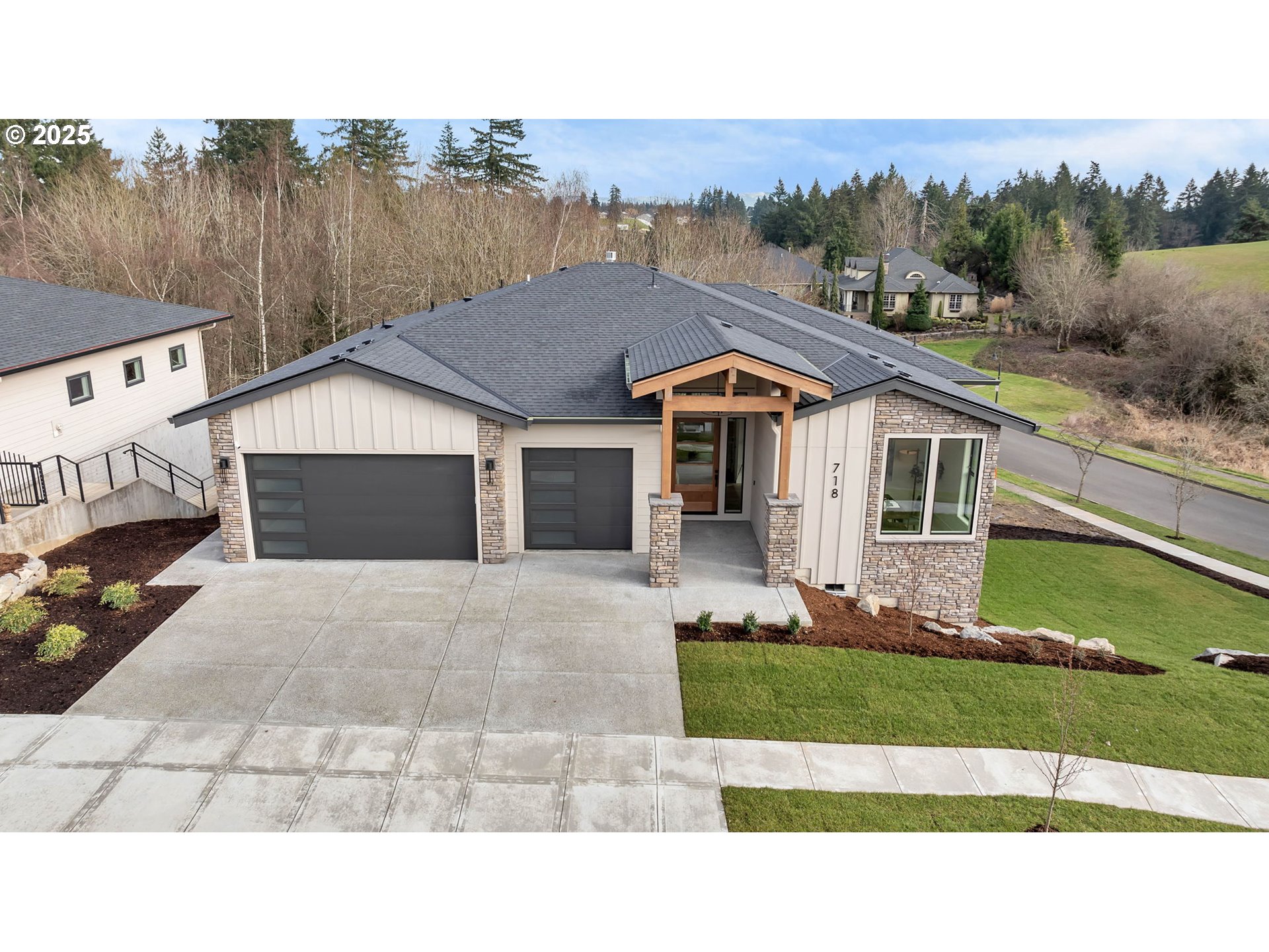 718 South 15th Court Ridgefield, WA 98642 - Photo 1 of 47 a house view with a garden space