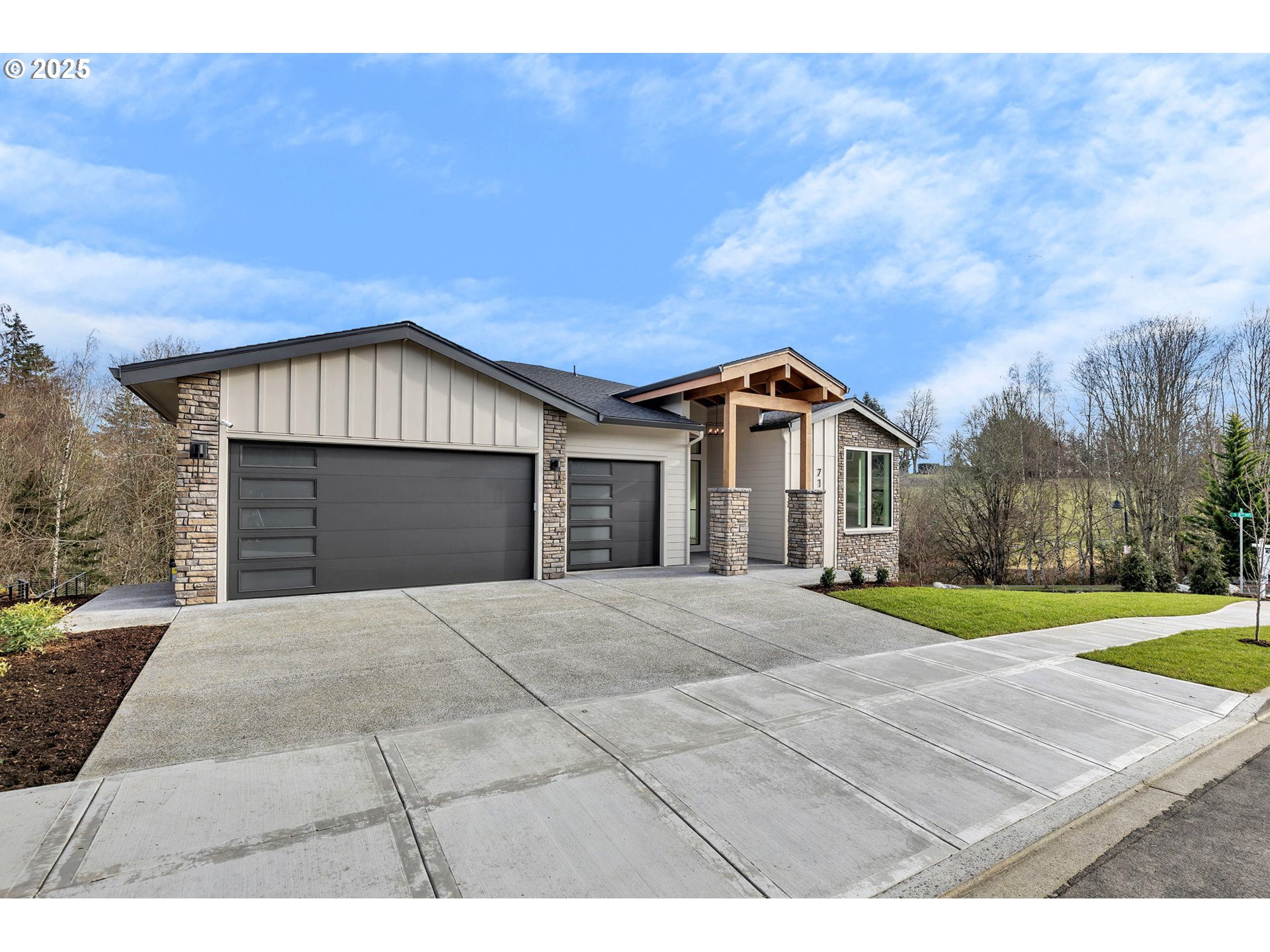718 South 15th Court Ridgefield, WA 98642 - Photo 2 of 47 a front view of a house with a yard and garage
